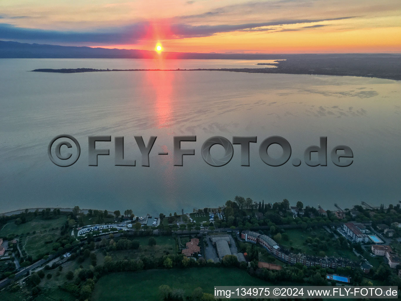 Sunrise at Barche Bellandi on Lake Garda in Desenzano del Garda in the state Brescia, Italy