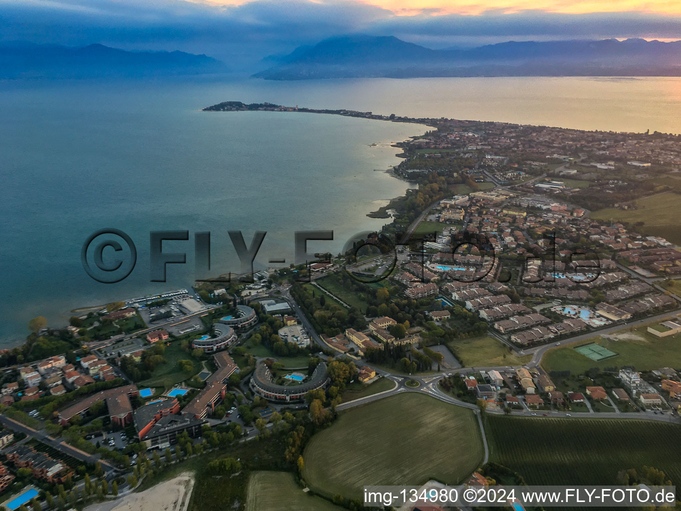 Sirmione peninsula on Lake Garda in the morning light in Desenzano del Garda in the state Brescia, Italy