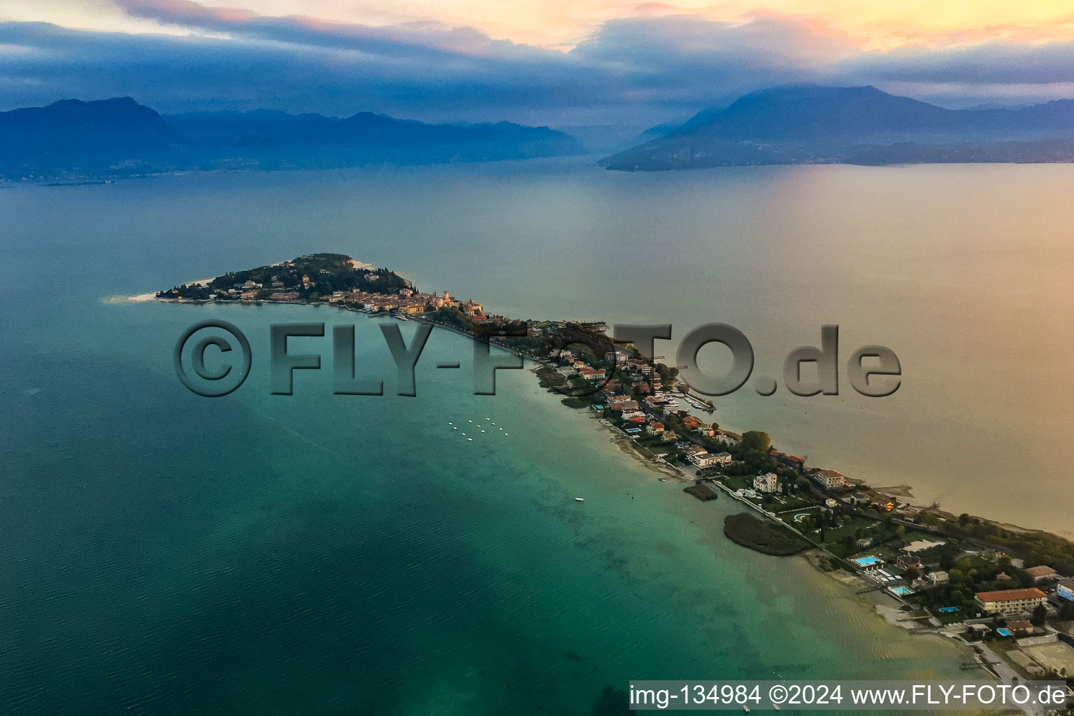 Morning mood over the Sirmione peninsula in Lake Garda in Sirmione in the state Brescia, Italy