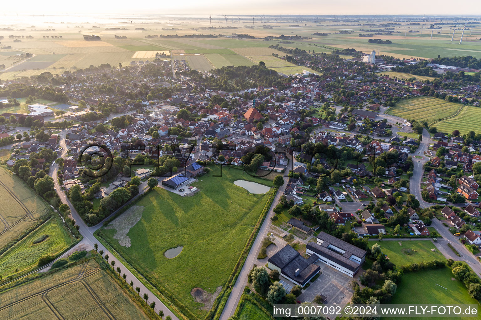 Village view on the edge of agricultural fields and land in Wesselburen in the state Schleswig-Holstein, Germany