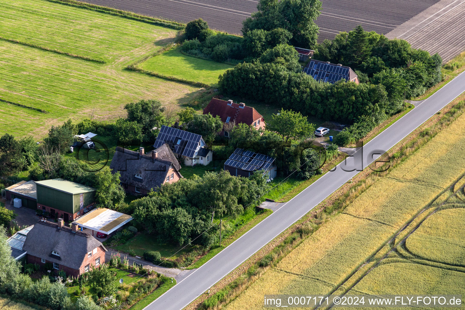 Oblique view of Former dike keeper's farms on Schülpersieler Straße in Wesselburenerkoog in the state Schleswig Holstein, Germany