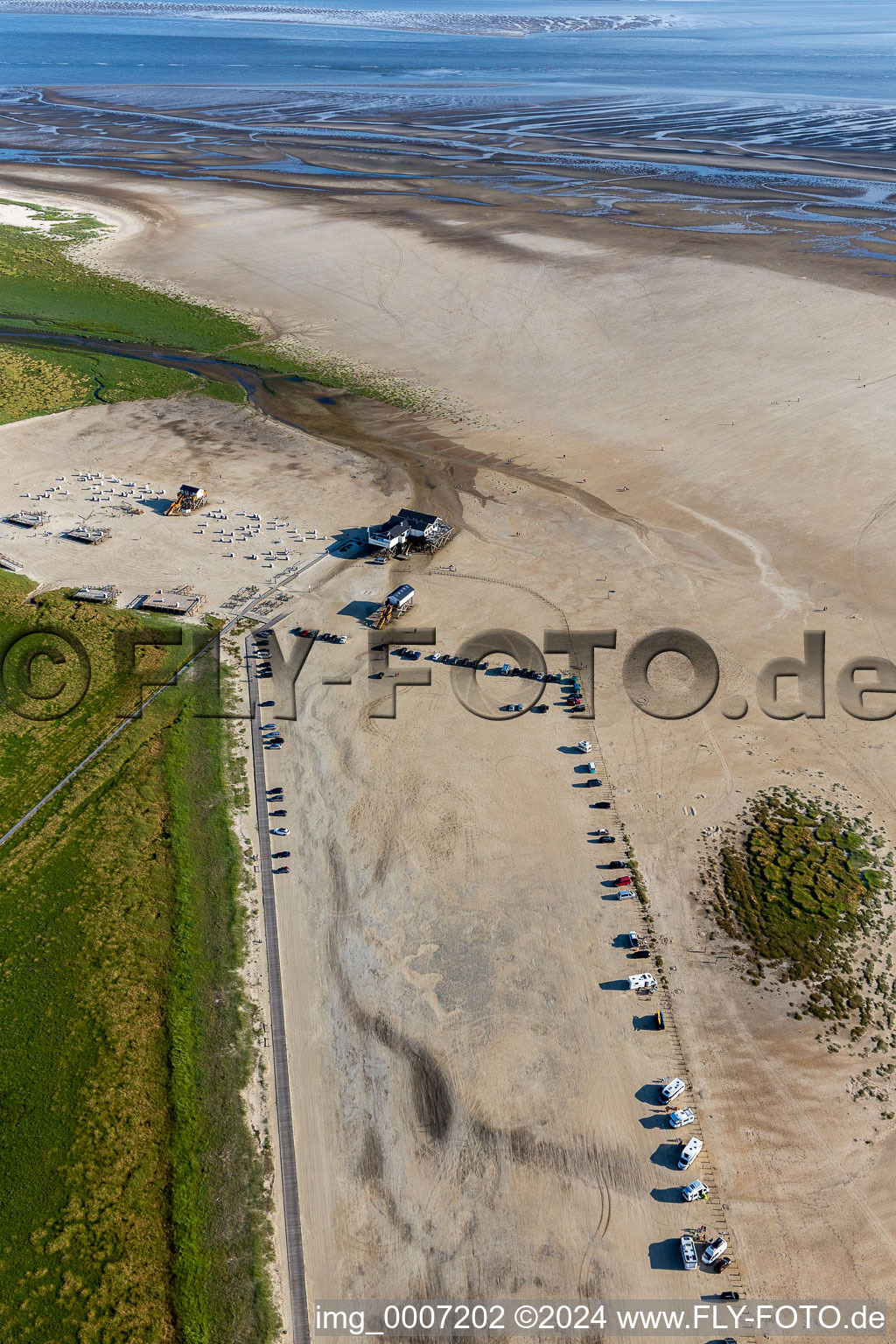 Aerial view of Sandy beach landscape on the North Sea - coast in the district of Sankt Peter-Ording Parking and gastronomy Die Seekiste in Sankt Peter-Ording in Schleswig-Holstein