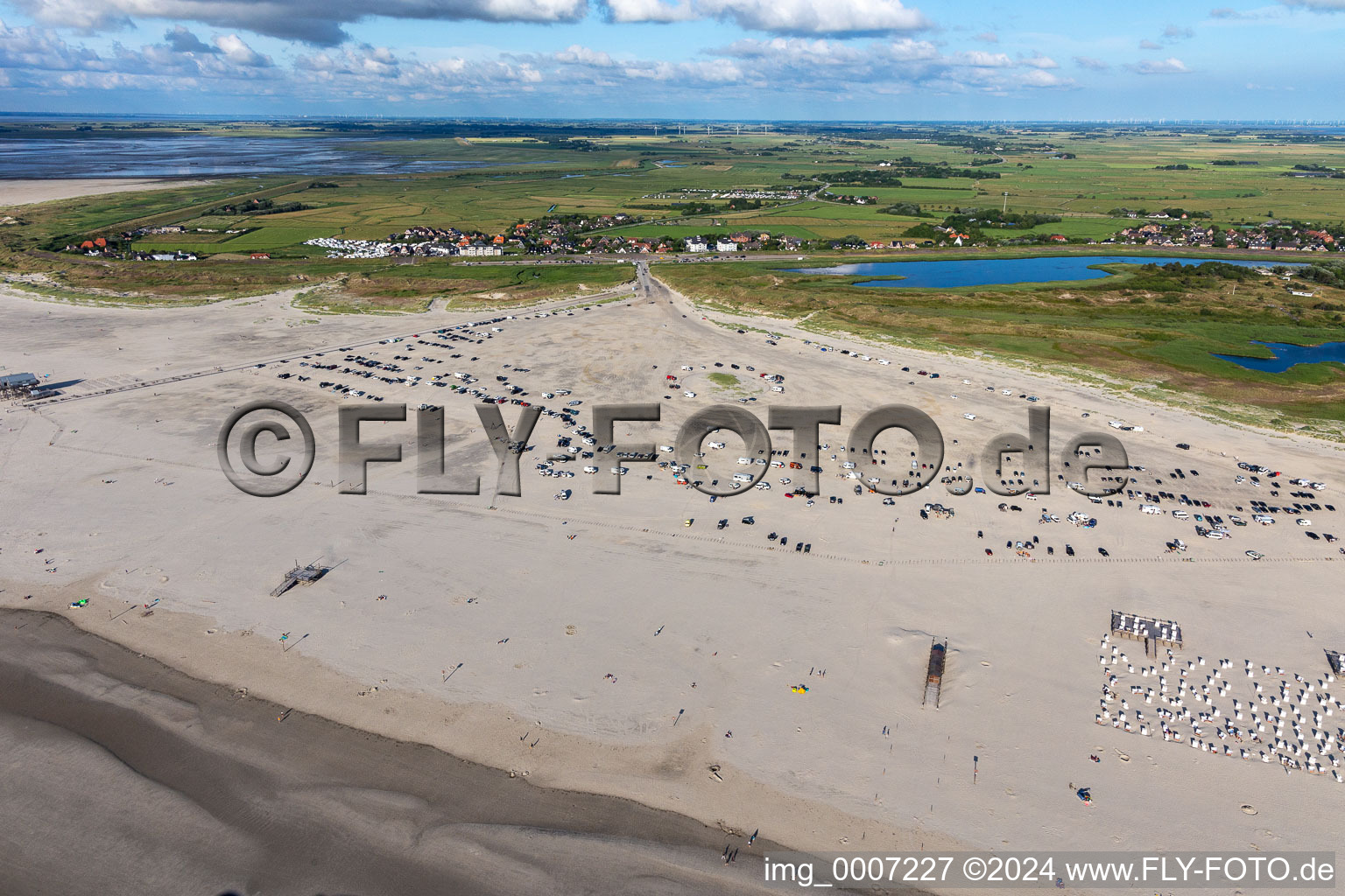 Aerial view of Beach chair on the sandy beach ranks in the coastal area of North Sea in the district Sankt Peter-Ording in Sankt Peter-Ording in the state Schleswig-Holstein, Germany