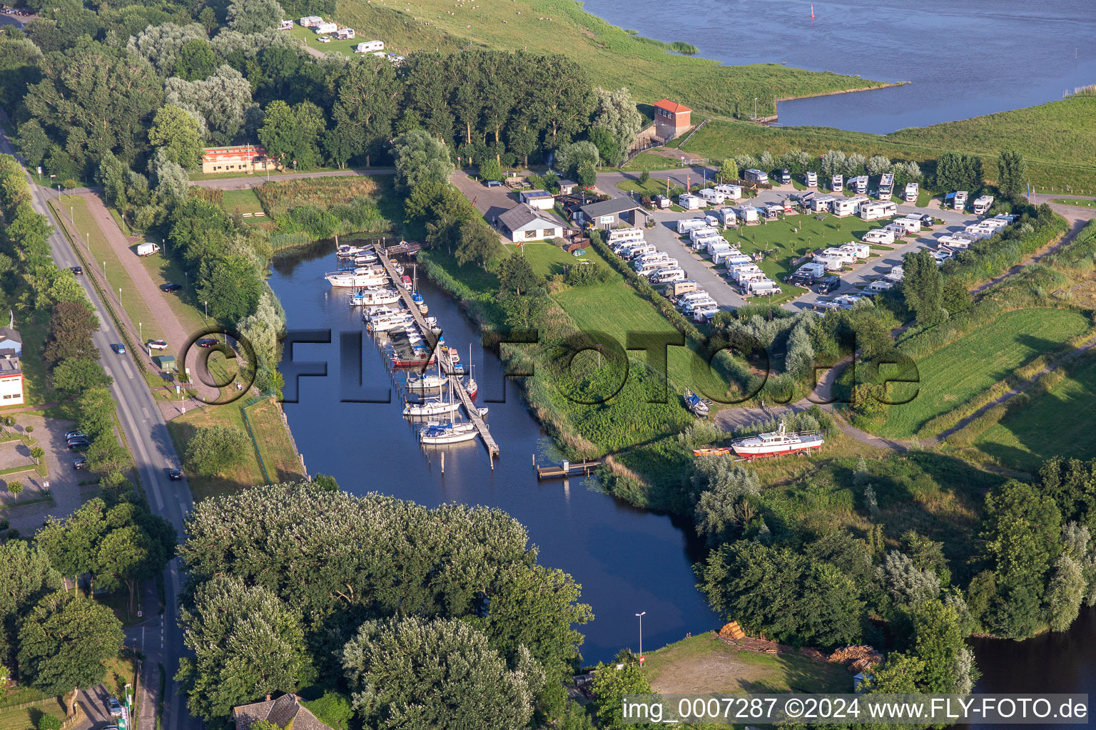 Pleasure boat marina of Motorbootclub Westkueste e.V. with docks and moorings on the shore area of Westersielzug in Friedrichstadt in the state Schleswig-Holstein, Germany