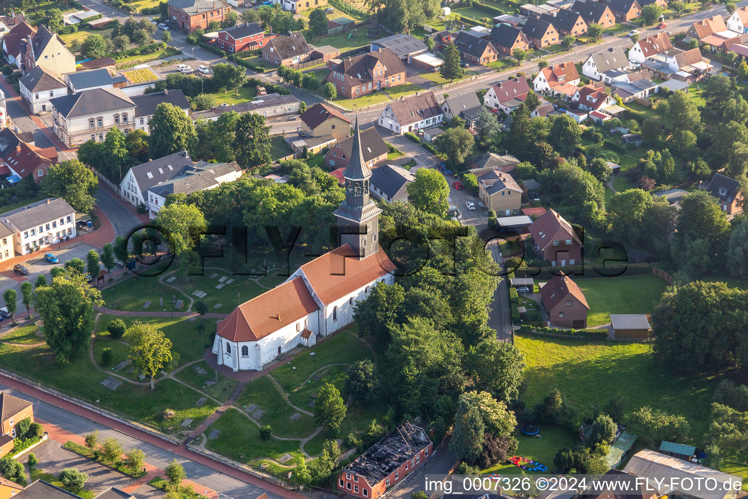 Church building and cimetery in the village of in Lunden in the state Schleswig-Holstein, Germany