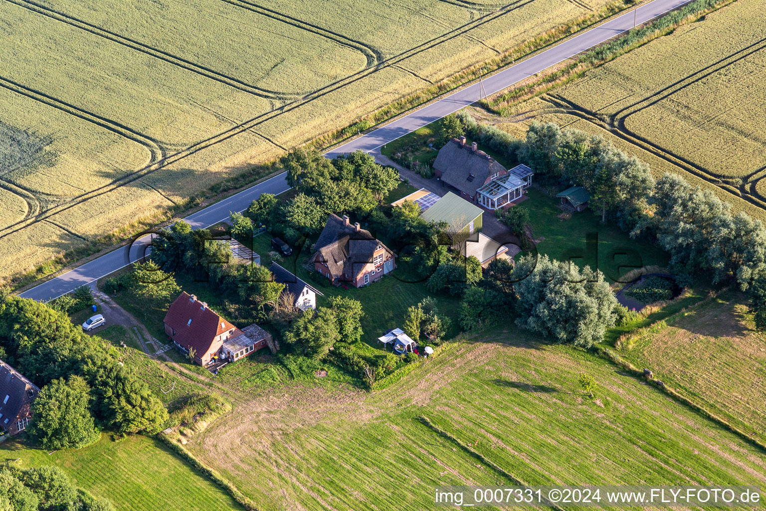 Former dike keeper's farms on Schülpersieler Straße in Wesselburenerkoog in the state Schleswig Holstein, Germany out of the air