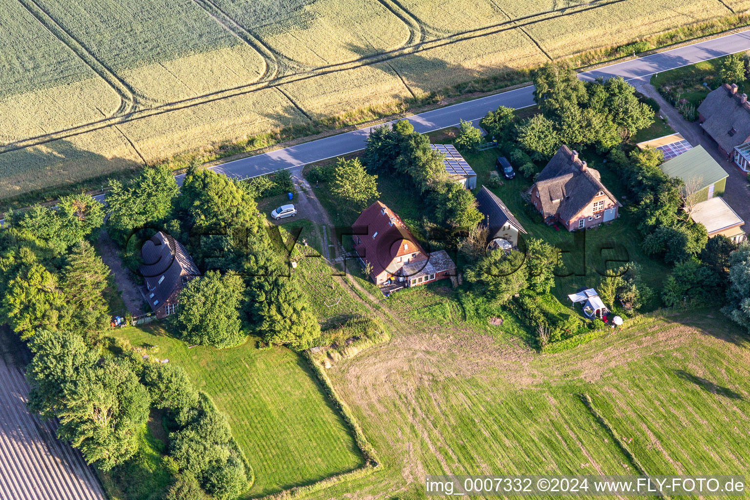 Former dike keeper's farms on Schülpersieler Straße in Wesselburenerkoog in the state Schleswig Holstein, Germany seen from above