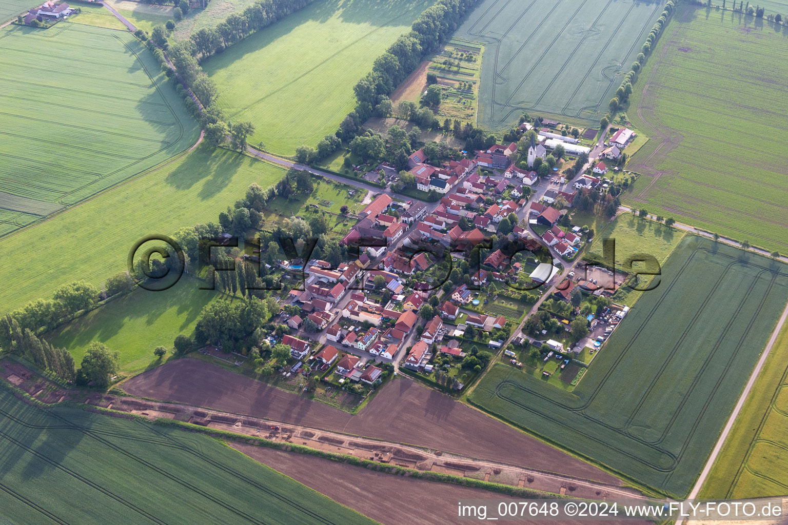 Agricultural land and field boundaries surround the settlement area of the village in Pfullendorf in the state Thuringia, Germany