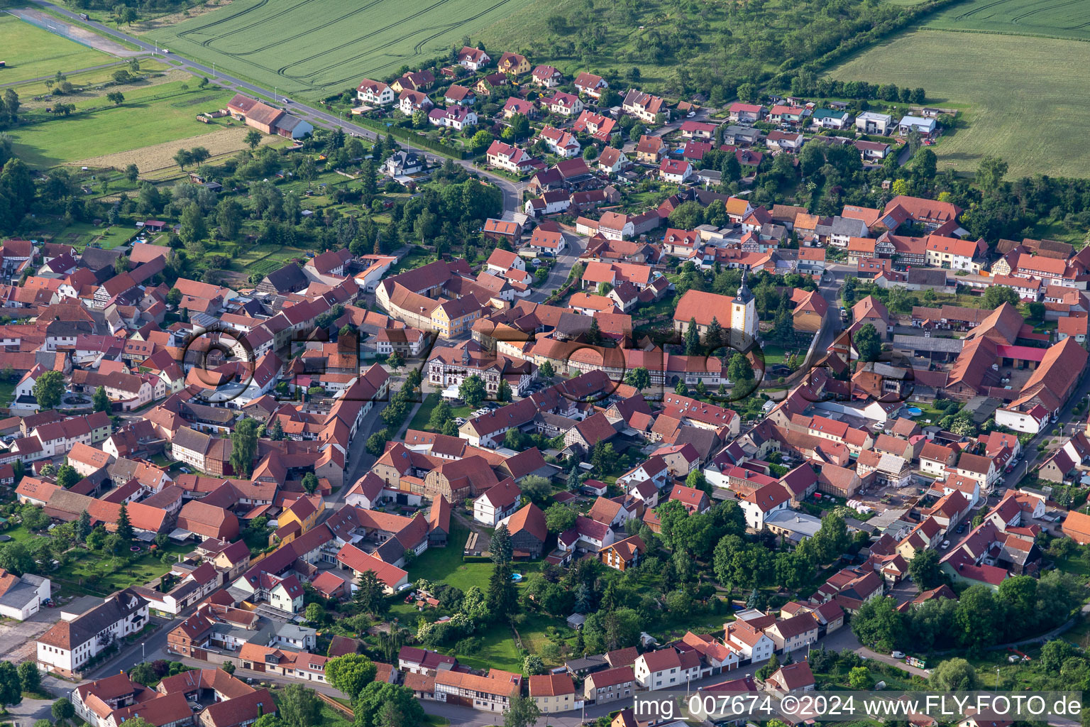 Aerial view of Town View of the streets and houses of the residential areas in Muehlberg in the state Thuringia, Germany