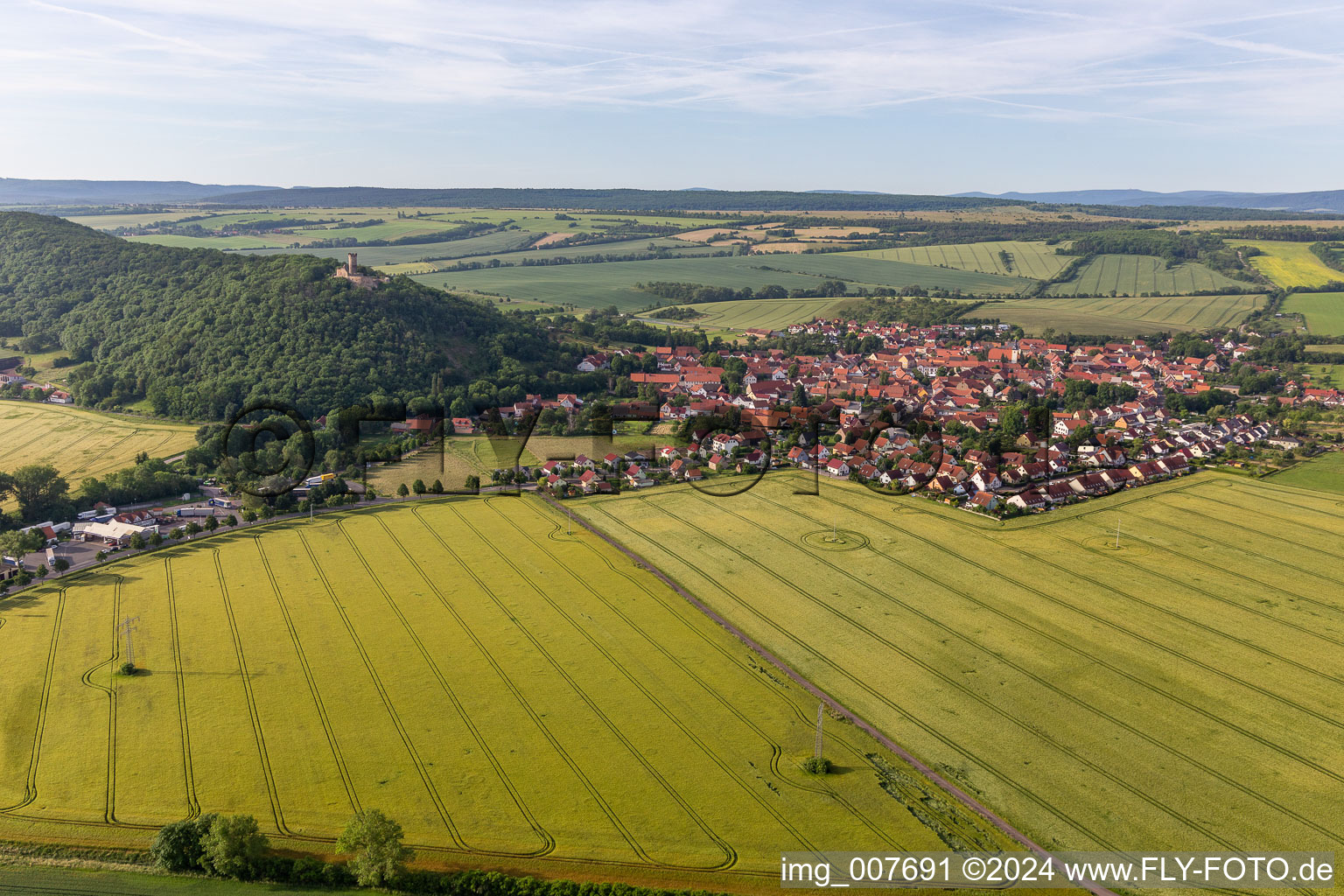 Village view on the edge of agricultural fields and land in Muehlberg in the state Thuringia, Germany