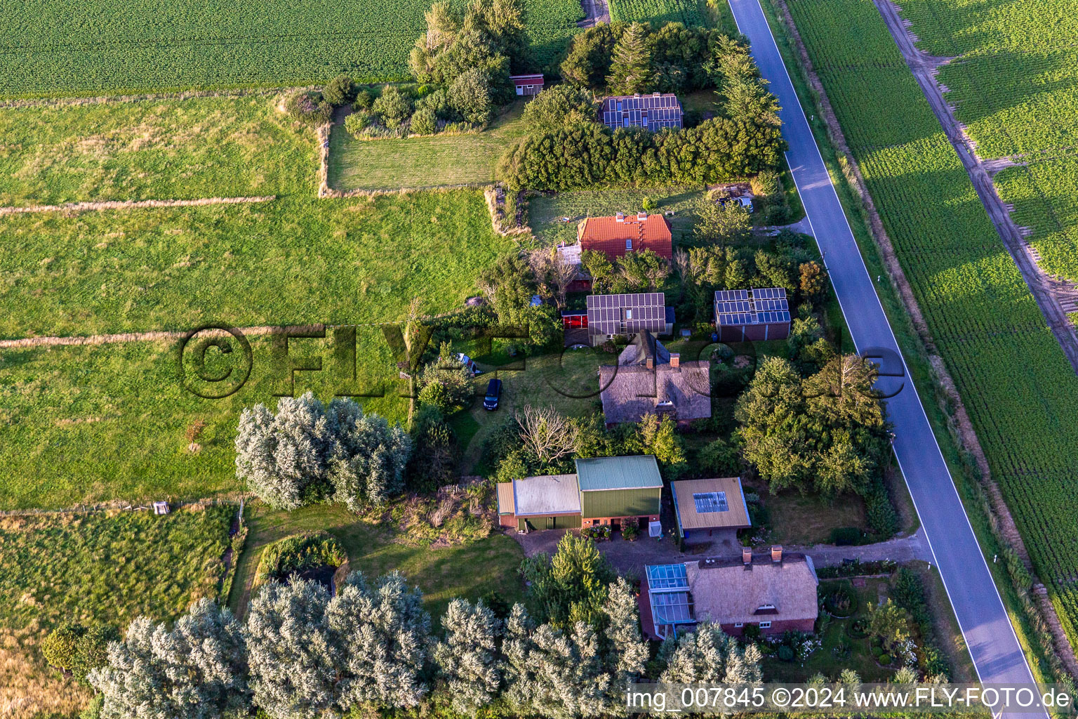 Schülpersieler Street in Wesselburenerkoog in the state Schleswig Holstein, Germany viewn from the air