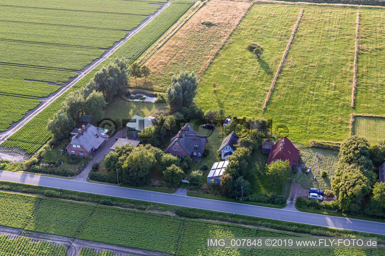 Schülpersieler Straße in Wesselburenerkoog in the state Schleswig Holstein, Germany from the drone perspective