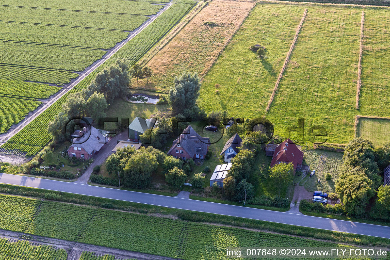 Schülpersieler Straße in Wesselburenerkoog in the state Schleswig Holstein, Germany from the drone perspective