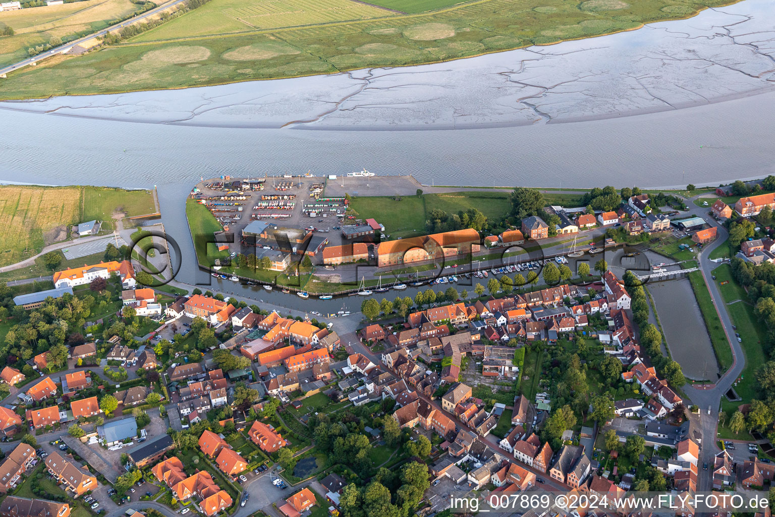 Village on the banks of the area Eider - river course in Toenning in the state Schleswig-Holstein, Germany