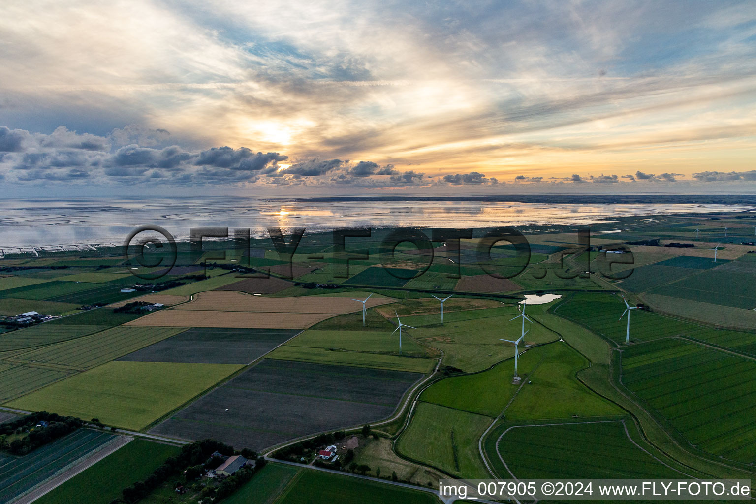 Wadden Sea of North Sea Coast with Windpark in Hedwigenkoog in the state Schleswig-Holstein, Germany