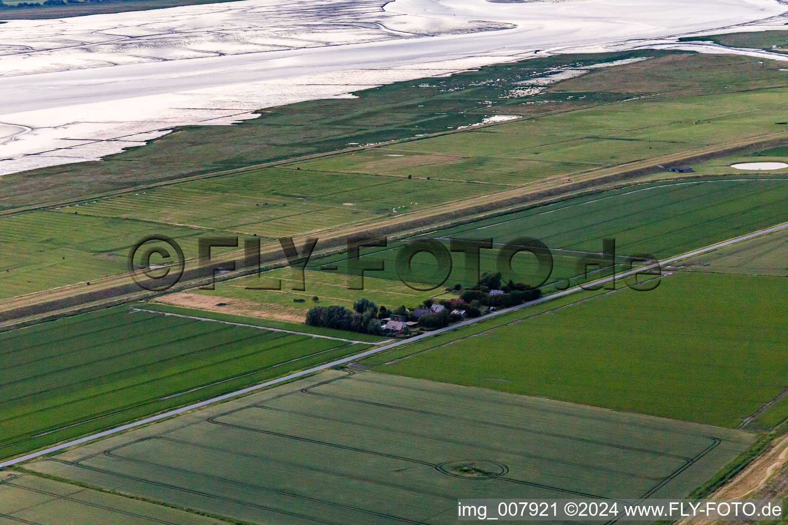 Schülpersieler Street in Wesselburenerkoog in the state Schleswig Holstein, Germany seen from a drone