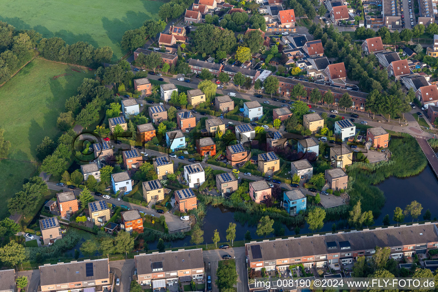 Aerial view of Residential area of coloured, cube-shapres, single-family design houses in settlement at shore areas in Enschede in Overijssel, Netherlands