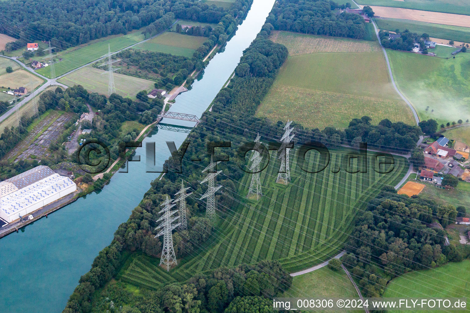 High-voltage lines cross the Wesel-Datteln Canal in the district Brassert in Marl in the state North Rhine-Westphalia, Germany