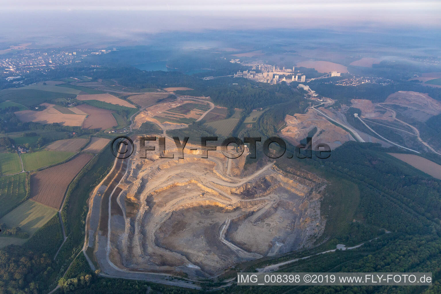 Oblique view of Rütkausen opencast mine of the Lhoist Rheinkalk plant in Flandersbach in Wülfrath in the state North Rhine-Westphalia, Germany