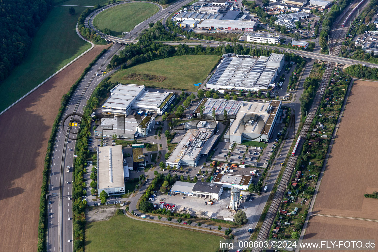Aerial view of Industrial and commercial area with Zeltwanger Maschinenbau GmbH, EUROMASTER GmbH, BayWa r.e. Solar Energy Systems GmbH and HIMMELWERK, Hoch- and Mittelfrequenzanlagen GmbH in Tuebingen in the state Baden-Wuerttemberg, Germany