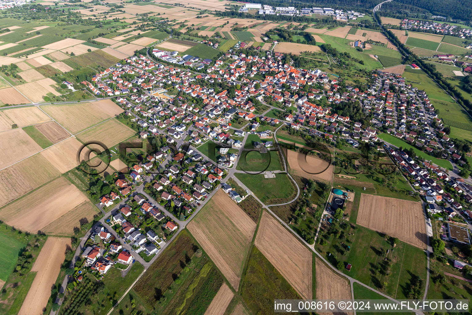 Agricultural land and field borders surround the settlement area of the village in Sickenhausen in the state Baden-Wuerttemberg, Germany