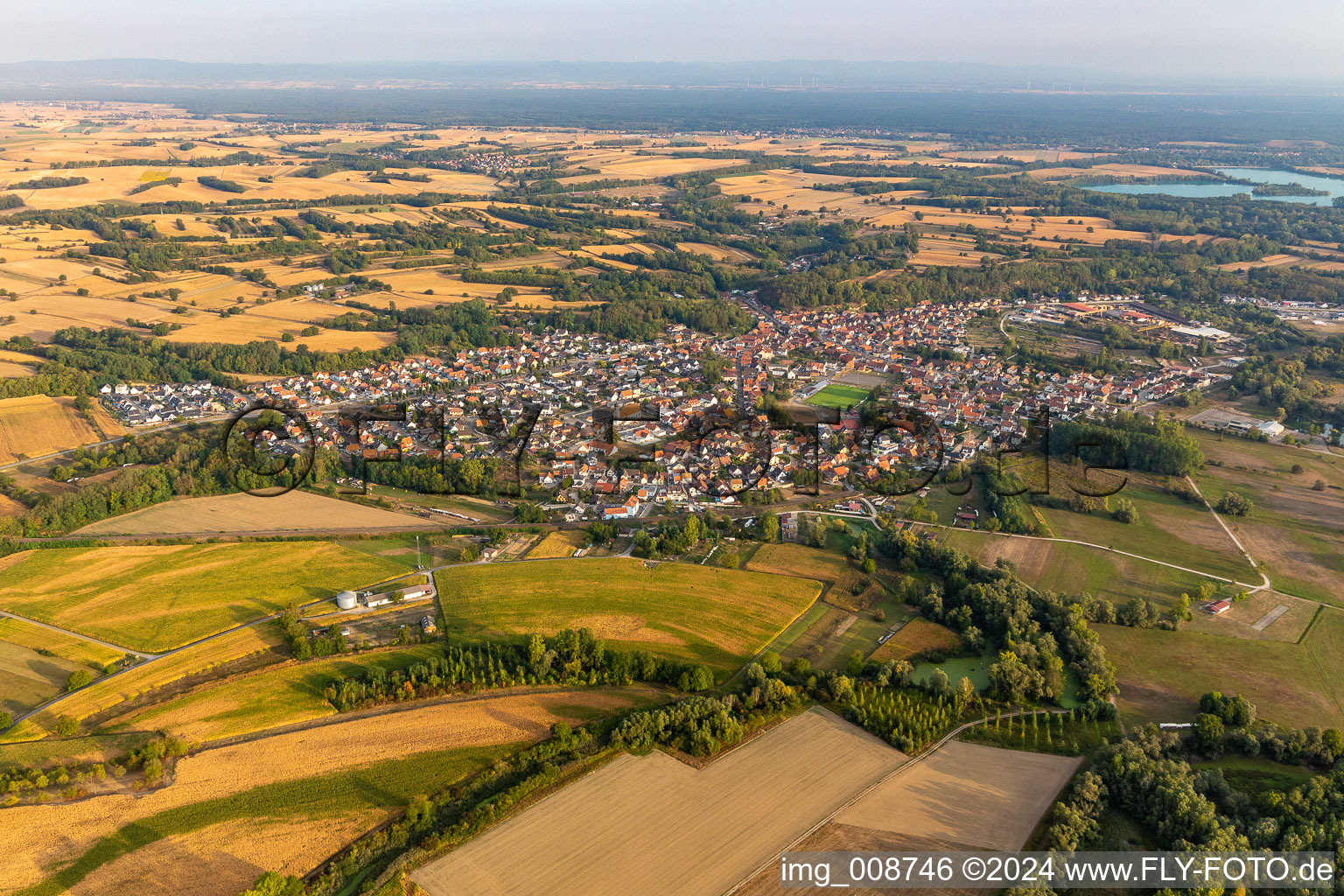 Aerial view of Village on the river bank areas of the Rhine river in Mothern in Grand Est, France