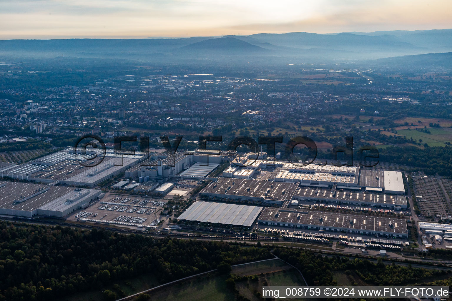 Building and production halls on the premises of Mercedes Benz factory Rastatt at sun-rise in Rastatt in the state Baden-Wuerttemberg, Germany