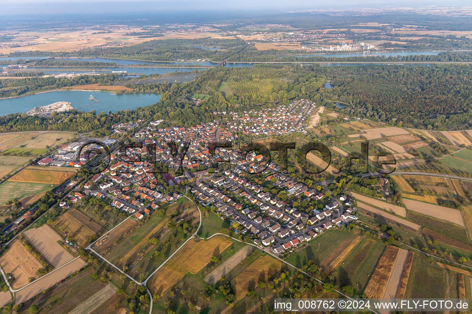 Aerial view of Village on the river bank areas of the Rhine river in Wintersdorf in the state Baden-Wuerttemberg, Germany