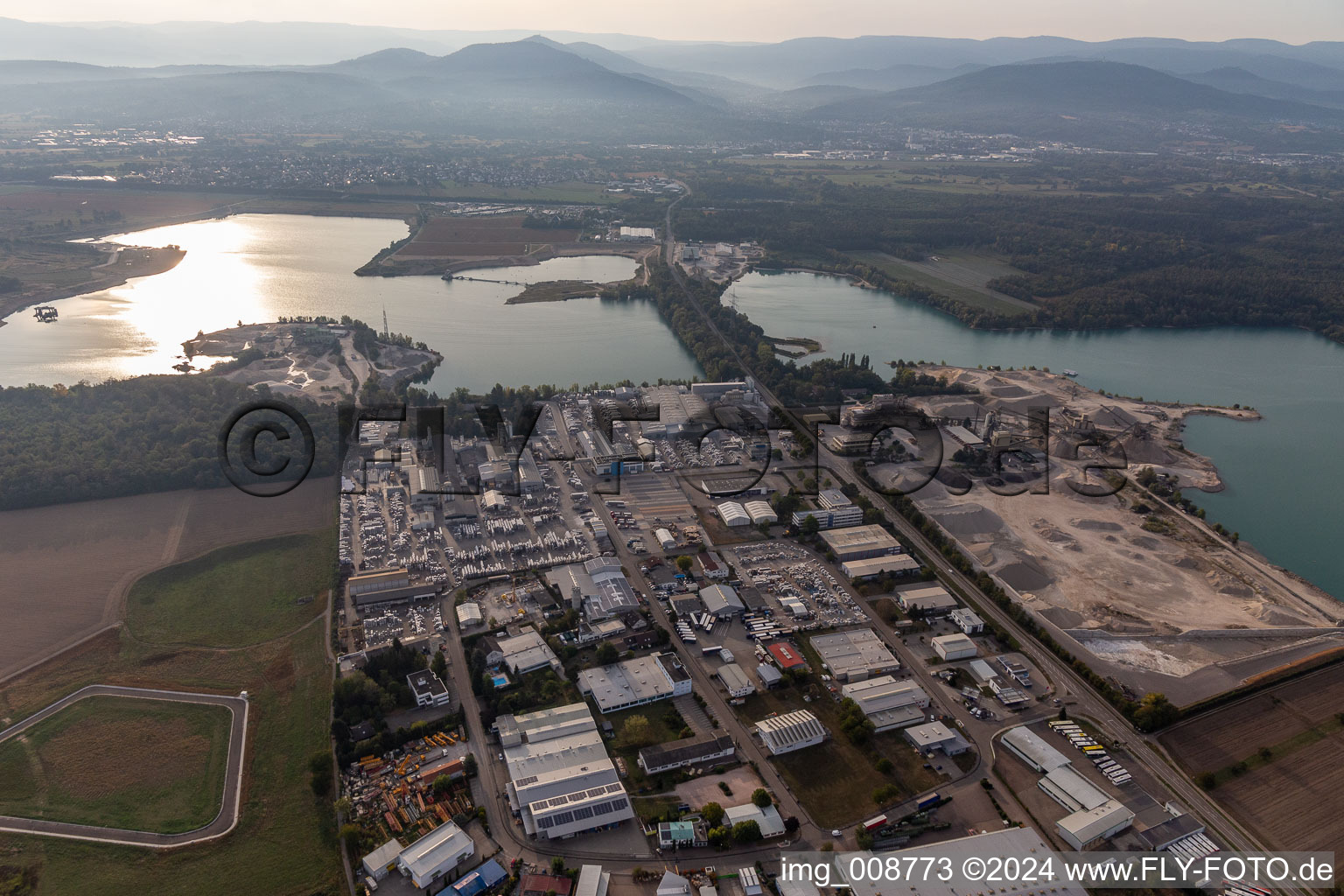 Industrial and commercial area Ost on Kuehlsee with ELMAKO GmbH & Co. KG, Kronimus AG Betonsteinwerk, IKE Iffezheimer Kies- and Edelsplittwerk Max Kern GmbH & Co. KG,BKG Transportbeton GmbH + Co. KG and SWA Suedwest Asphalt GmbH & Co. KG in Iffezheim in the state Baden-Wuerttemberg, Germany