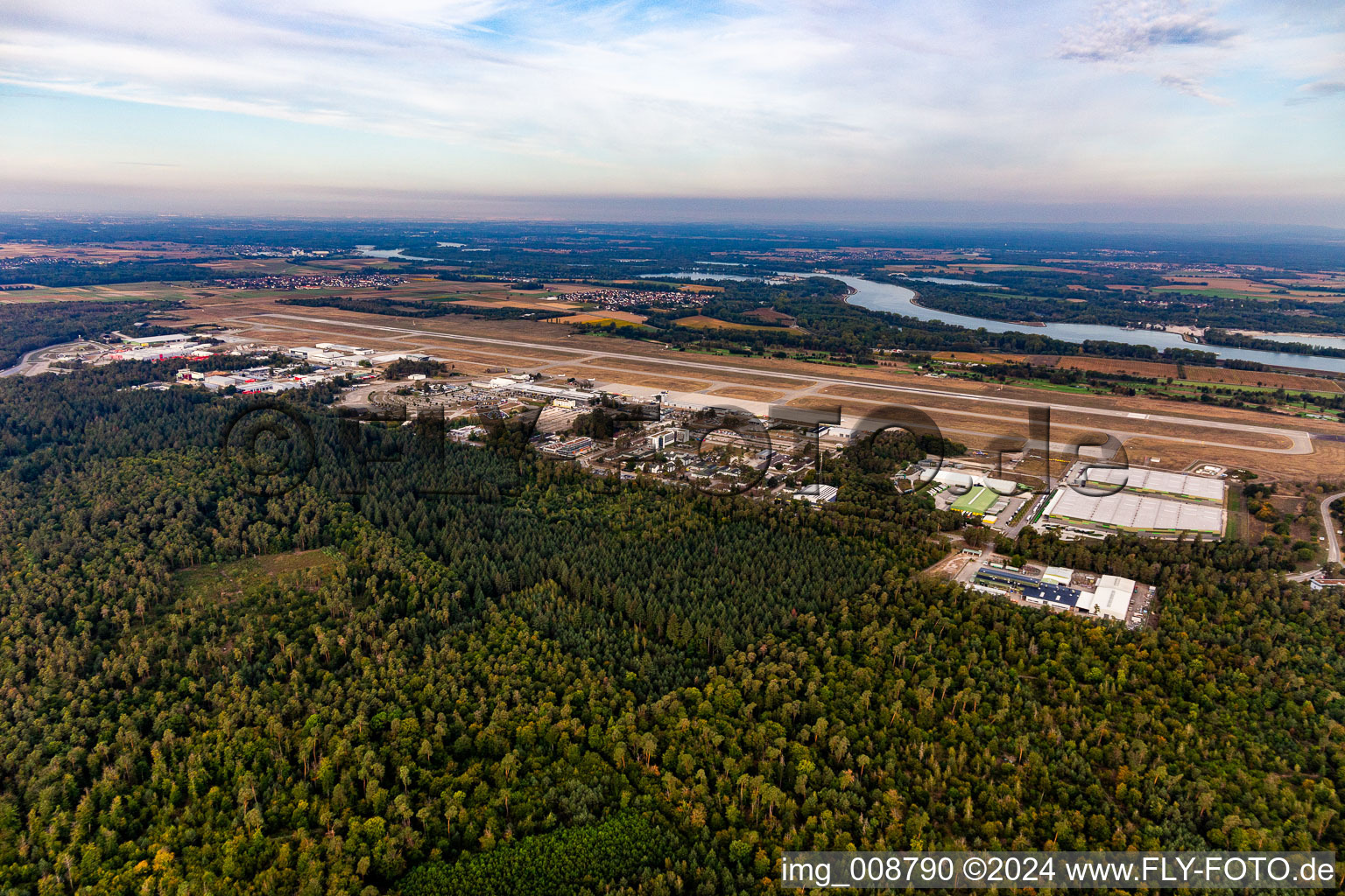 Aerial view of Runway with hangar taxiways and terminals on the grounds of the airport Karlsruhe / Baden-Baden (FKB) in Rheinmuenster in the state Baden-Wuerttemberg, Germany