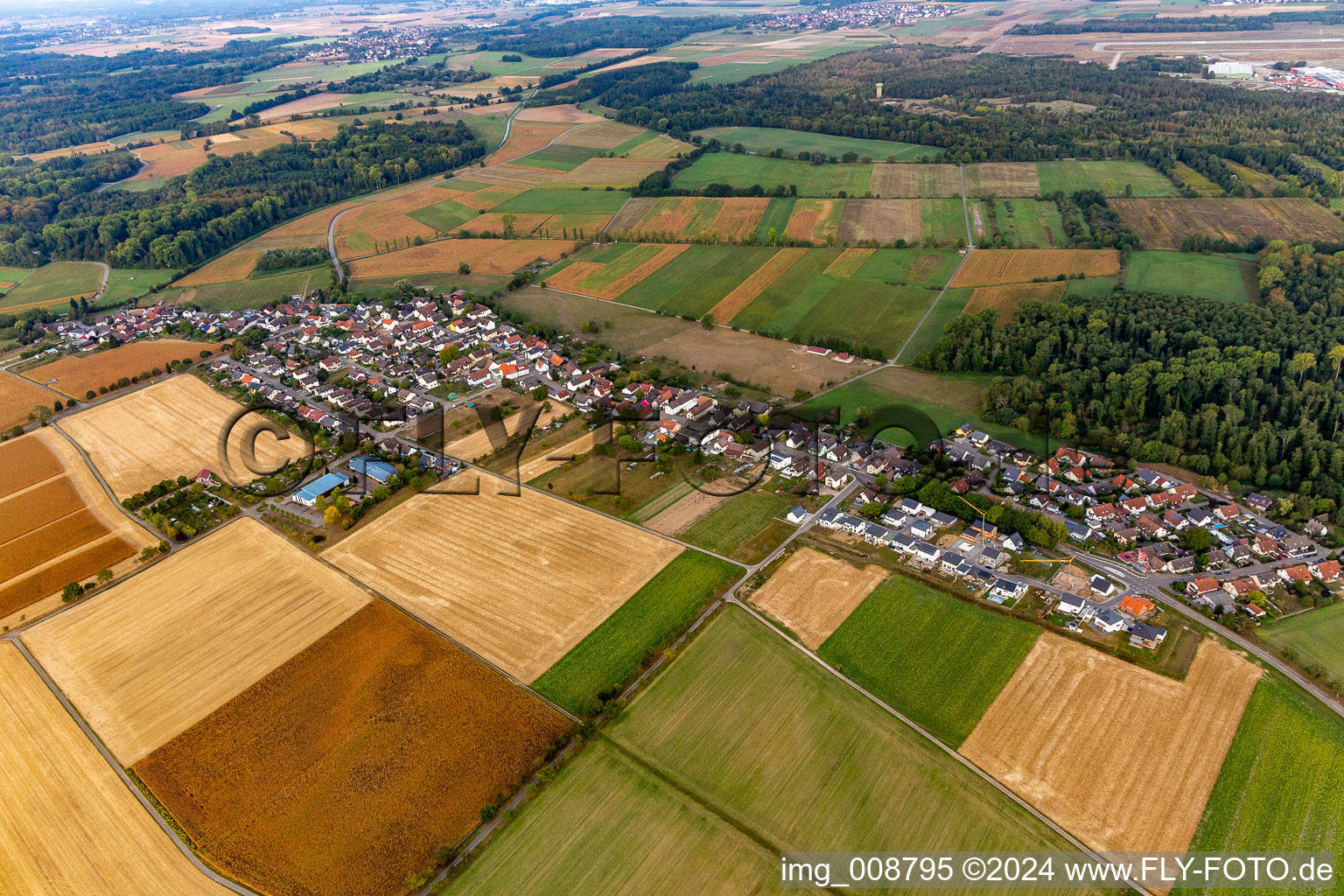 Agricultural land and field borders surround the settlement area of the village in Leiberstung in the state Baden-Wuerttemberg, Germany