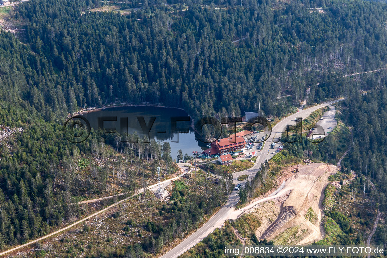 Forests on the shores of Lake Mummelsee with Berghotel Mummelsee33 in Seebach in the state Baden-Wurttemberg, Germany