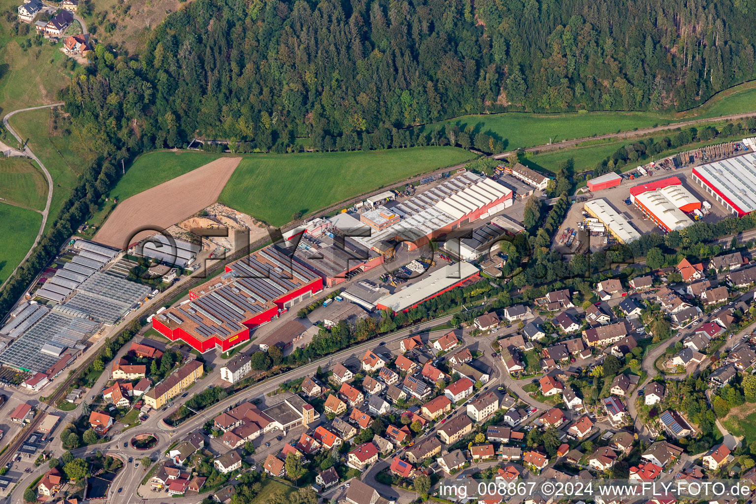 Aerial view of Buildings and production halls on the vehicle construction site of DOLL Fahrzeugbau GmbH in Oppenau in the state Baden-Wuerttemberg, Germany