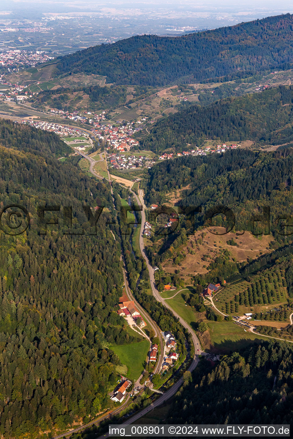 Valley landscape surrounded by mountains with B38, mill dig and Renchtal-rail-track in Lautenbach in the state Baden-Wuerttemberg, Germany