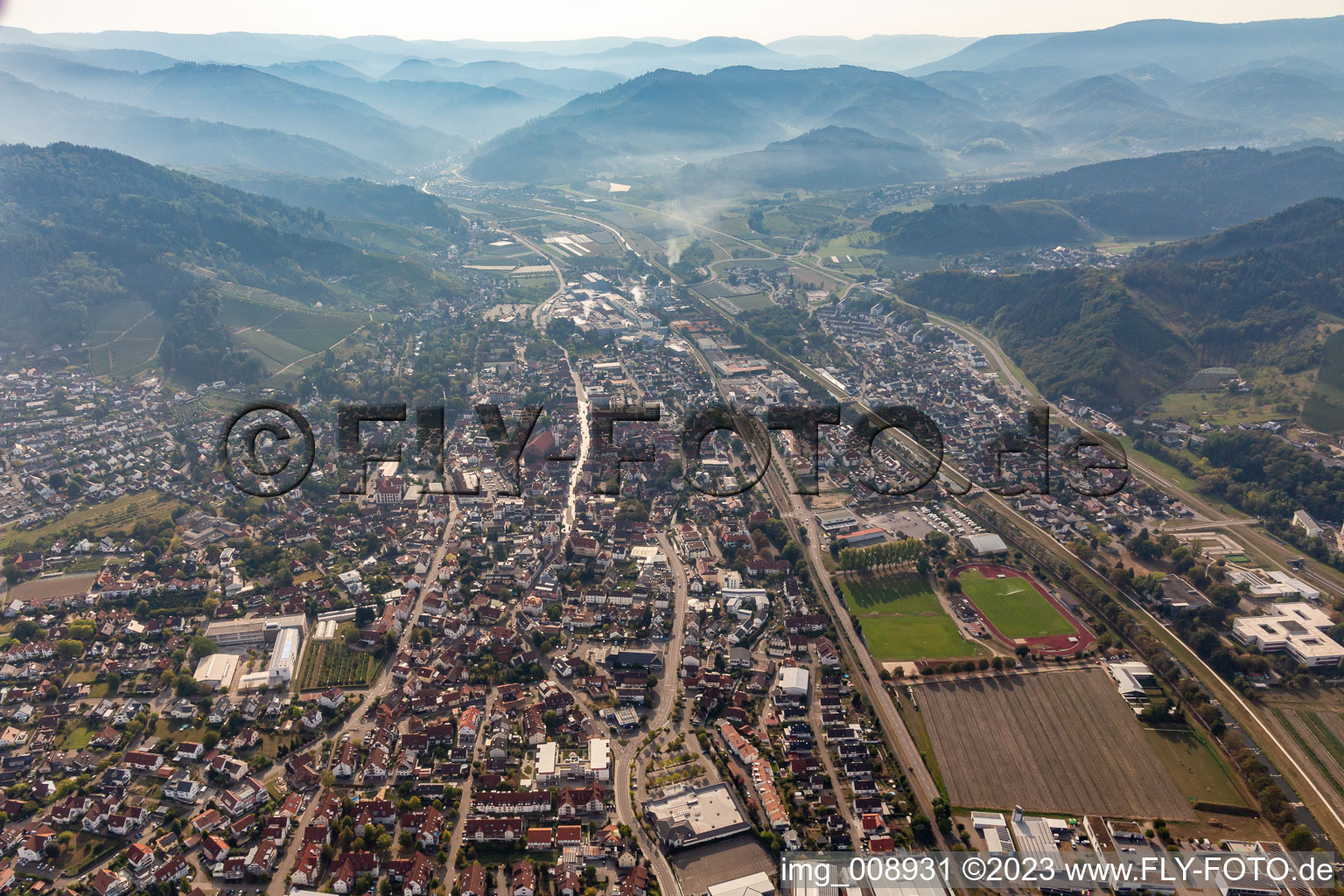 Location view of the streets and houses of residential areas in the Rench valley landscape surrounded by mountains of the black forest in Oberkirch in the state Baden-Wuerttemberg, Germany