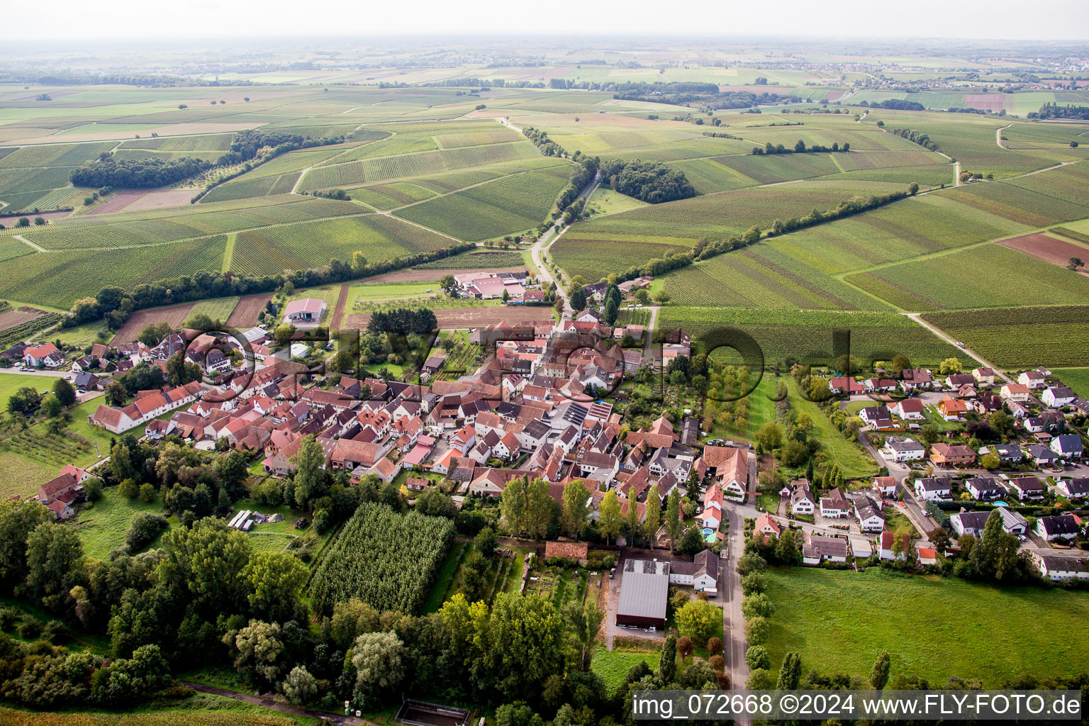 Village - view on the edge of agricultural fields and farmland in the district Klingen in Heuchelheim-Klingen in the state Rhineland-Palatinate, Germany