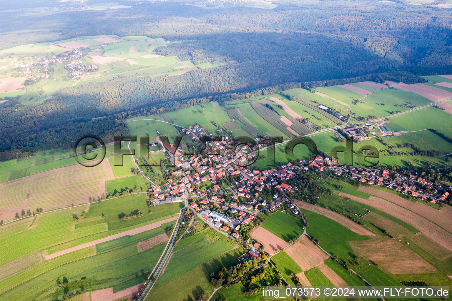 Village - view on the edge of agricultural fields and farmland in Schollbrunn in the state Baden-Wurttemberg, Germany