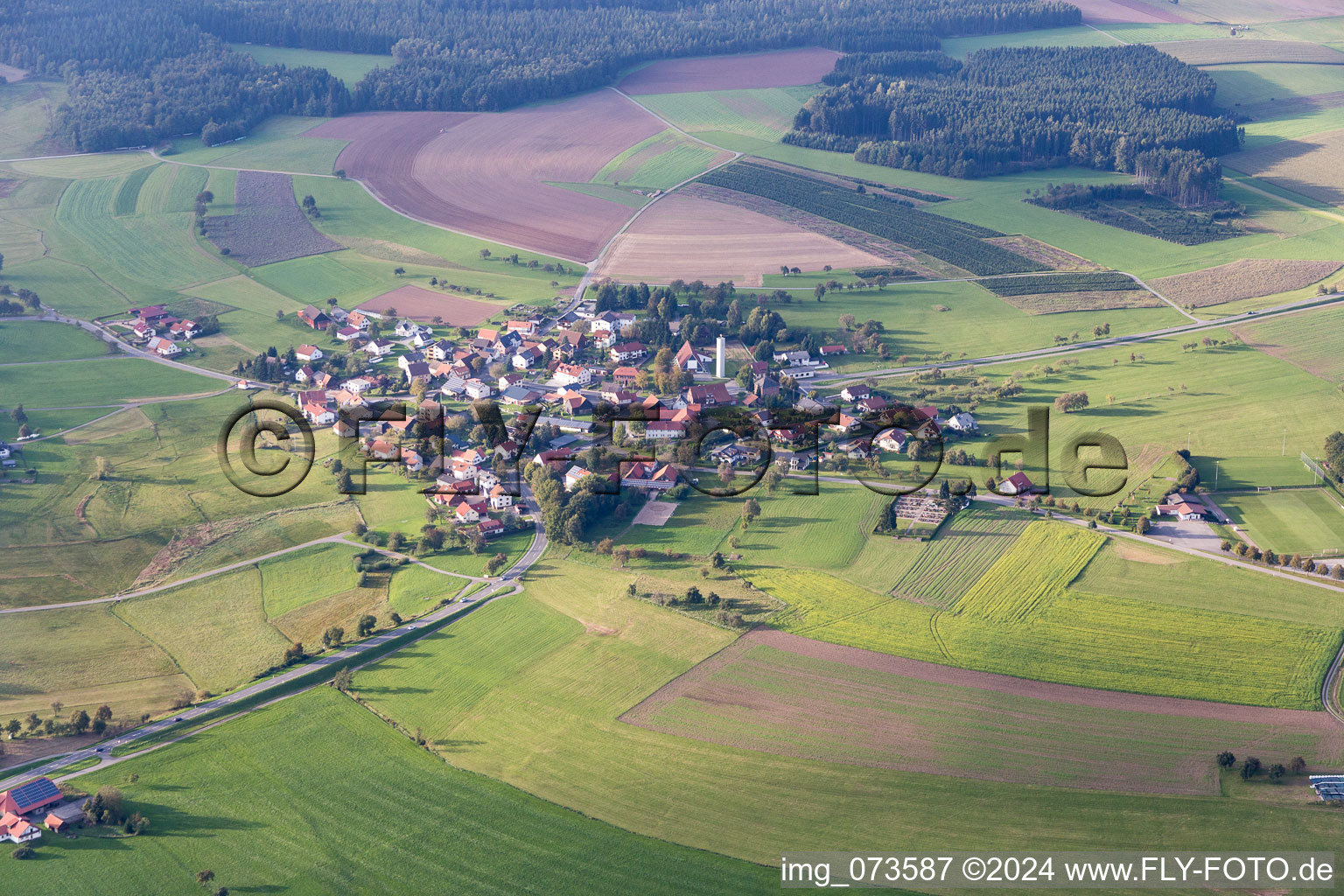 Village - view on the edge of agricultural fields and farmland in the district Scheidental in Mudau in the state Baden-Wurttemberg, Germany