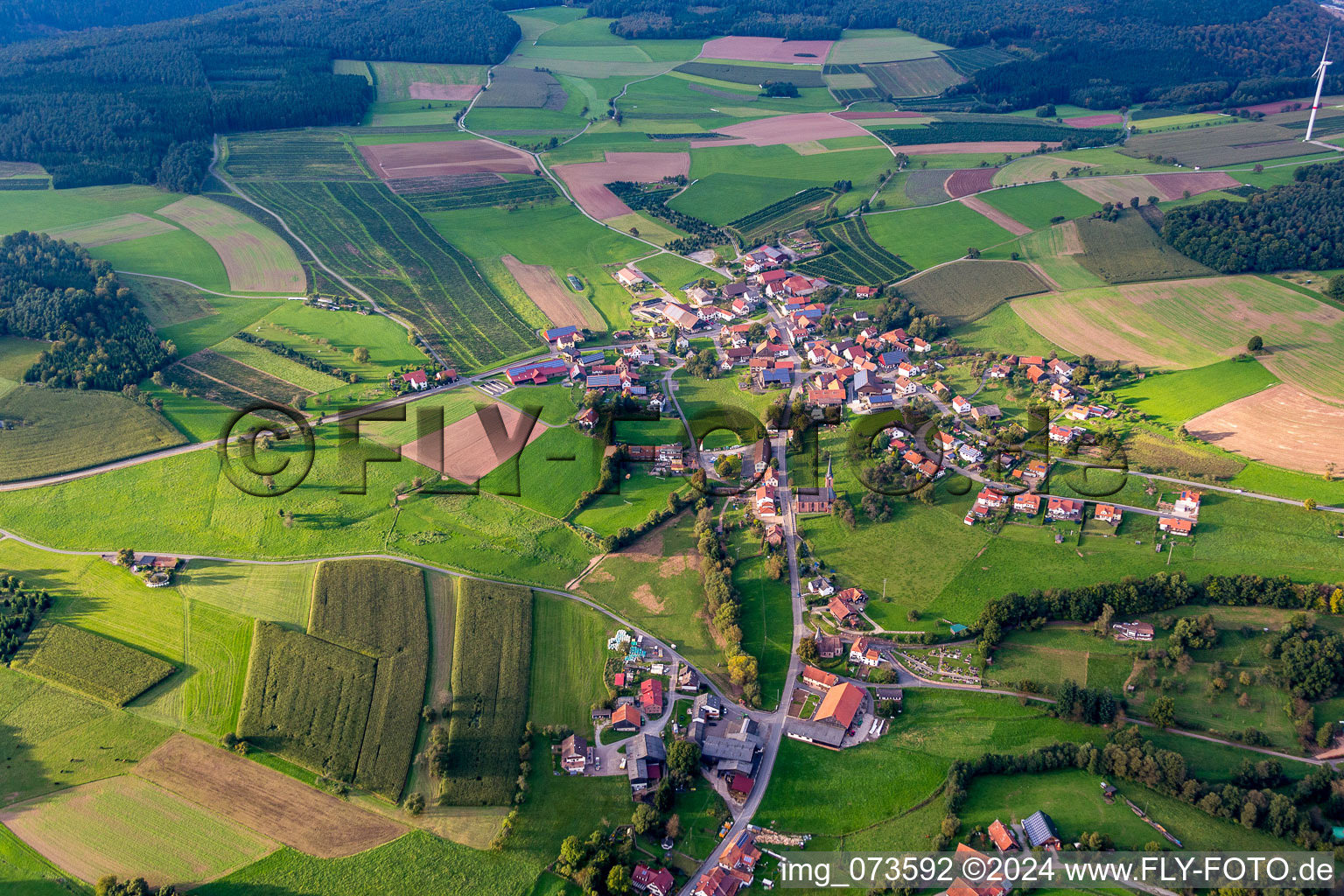 Village - view on the edge of agricultural fields and farmland in the district Steinbach in Mudau in the state Baden-Wurttemberg, Germany