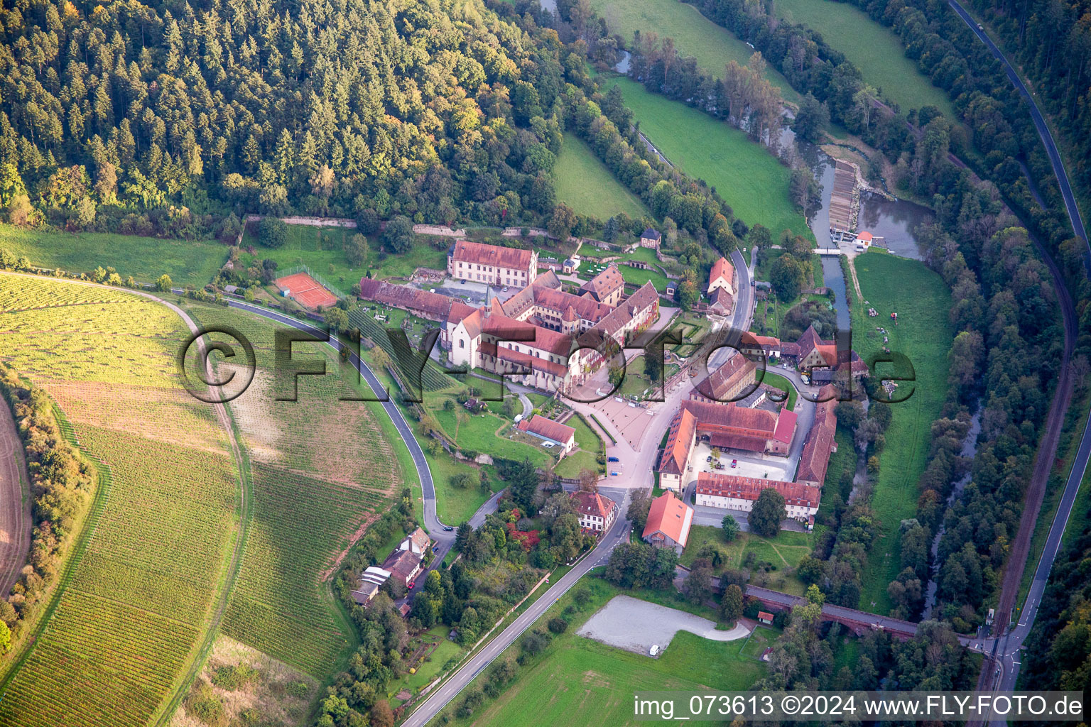 Complex of buildings of the monastery Bronnbach with garden and Church Mariae Himmelfahrt in Wertheim in the state Baden-Wurttemberg, Germany