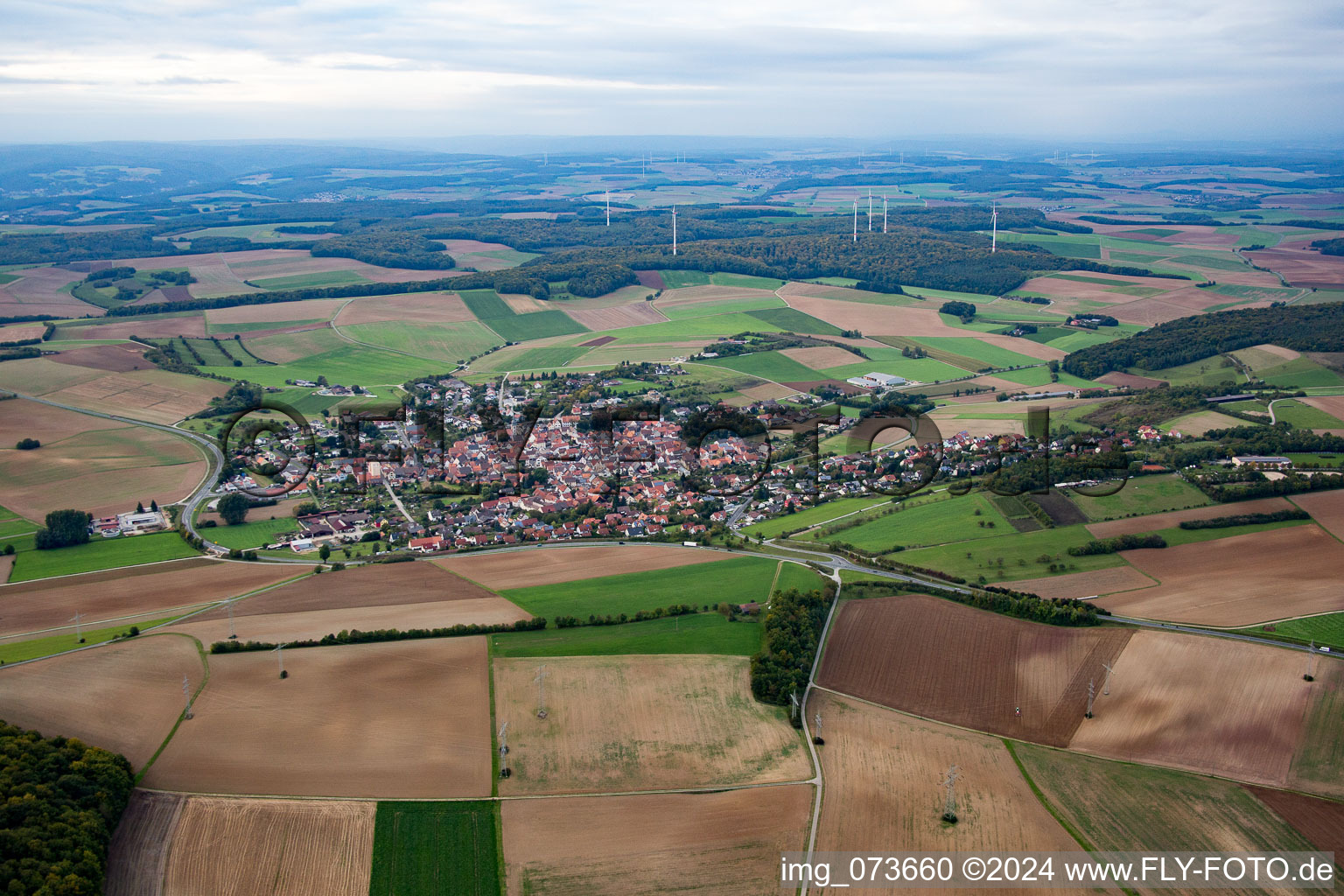 Village - view on the edge of agricultural fields and farmland in Uettingen in the state Bavaria, Germany