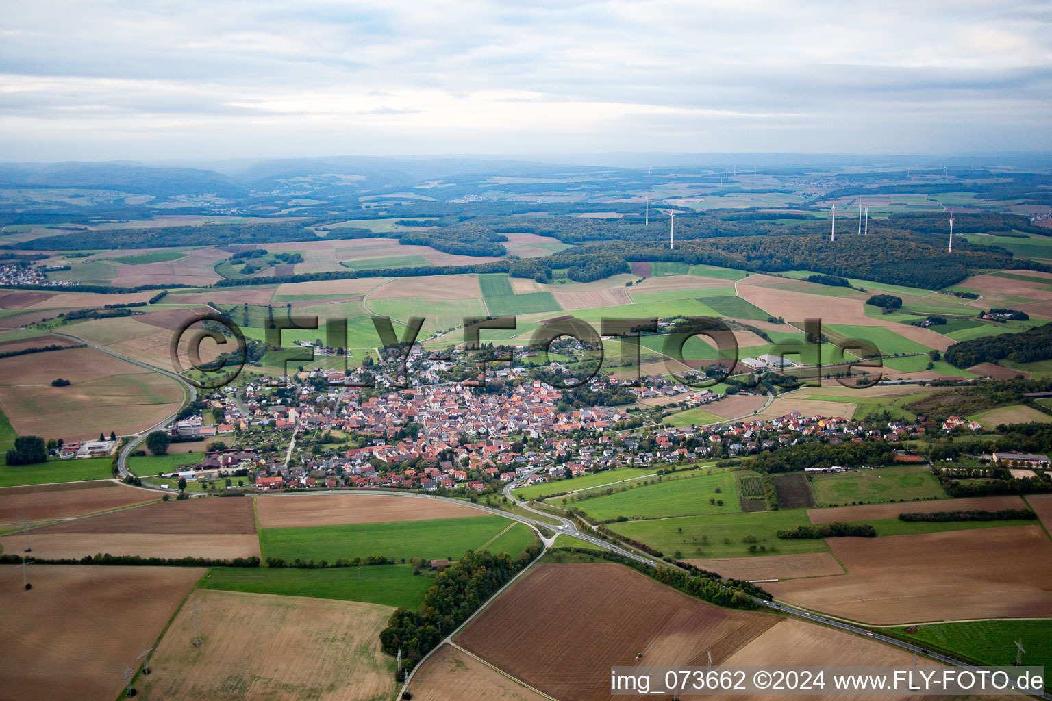 Aerial view of Village - view on the edge of agricultural fields and farmland in Uettingen in the state Bavaria, Germany