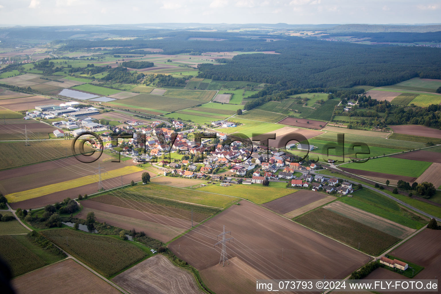 Village - view on the edge of agricultural fields and farmland in Unterhaid in the state Bavaria, Germany