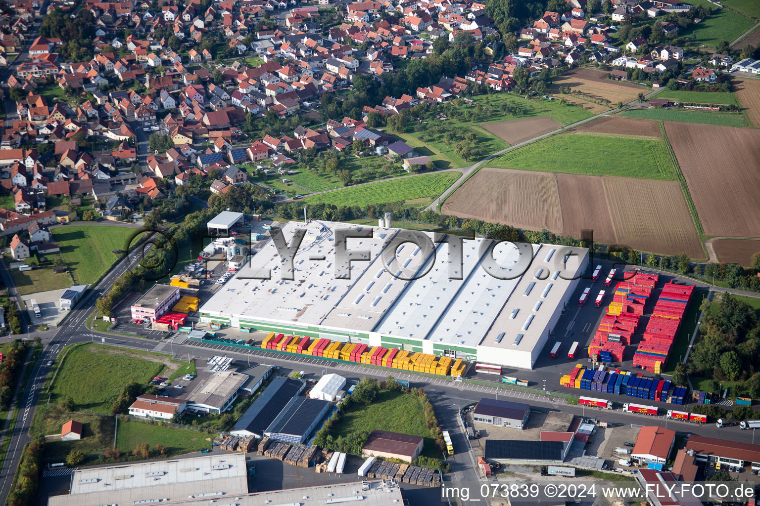 Oblique view of Industrial estate and company settlement Gewerbegebiet An of Siechkapelle in Knetzgau in the state Bavaria, Germany