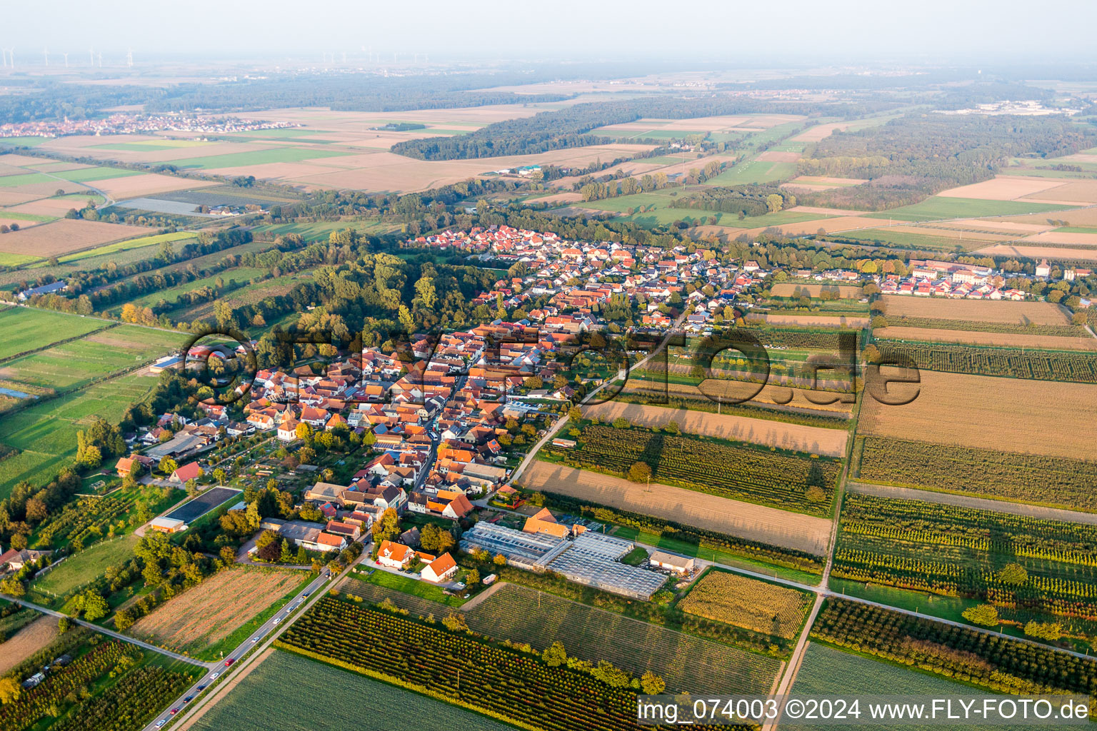 Village - view on the edge of agricultural fields and farmland in Winden in the state Rhineland-Palatinate, Germany