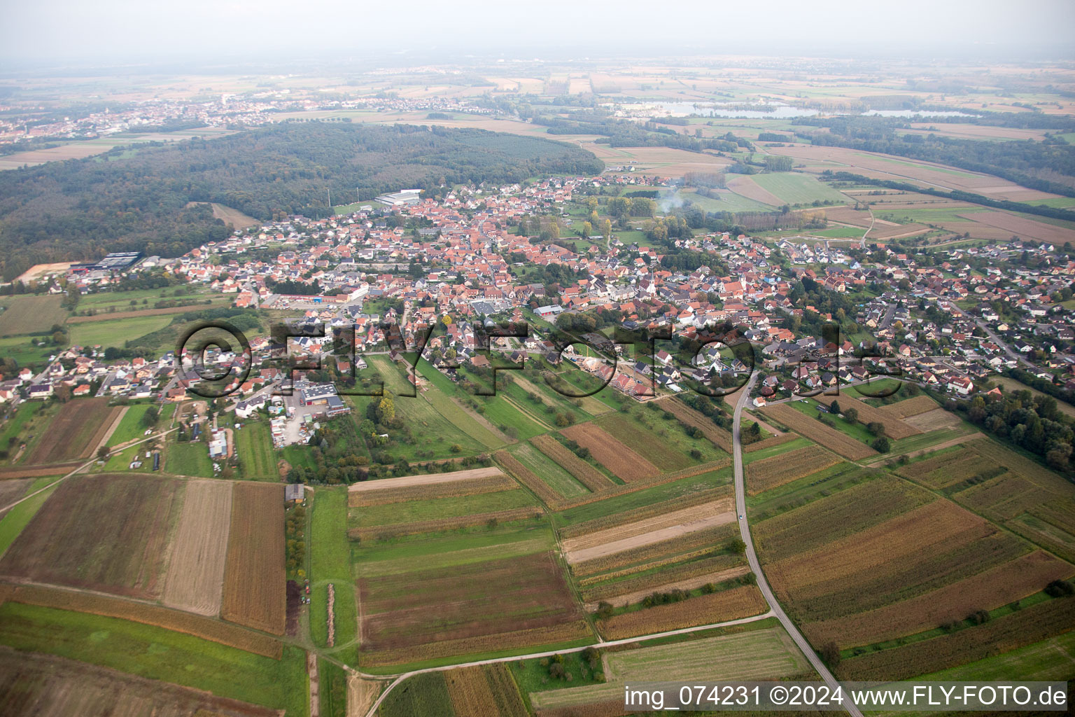 Village - view on the edge of agricultural fields and farmland in Gries in Grand Est, France