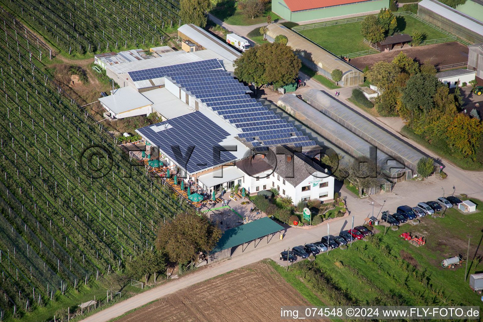 Tables and benches of open-air cafe Zapf Hofmarkt and farm cafe in Kandel in the state Rhineland-Palatinate, Germany