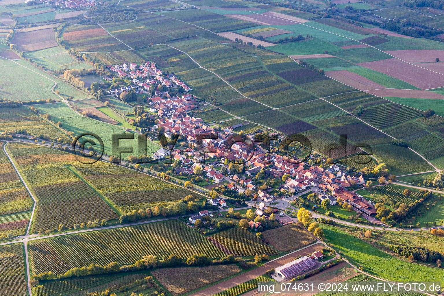Village - view on the edge of agricultural fields and farmland in Niederhorbach in the state Rhineland-Palatinate, Germany