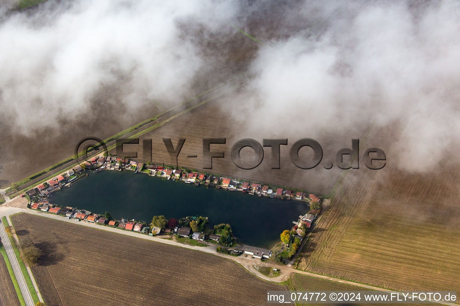 Burgsee under clouds in the district Hofheim in Lampertheim in the state Hesse, Germany