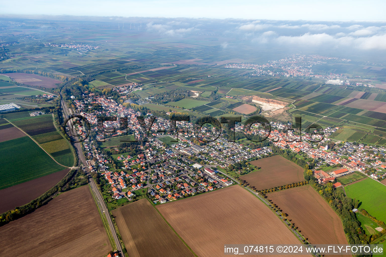 Village - view on the edge of agricultural fields and farmland in Monsheim in the state Rhineland-Palatinate, Germany